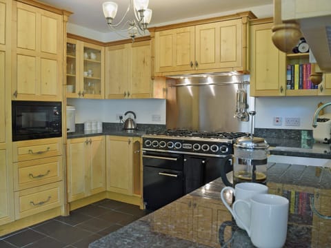 Beautifully presented kitchen/dining room with patio doors leading to garden | Cornant, Llechryd, near Cardigan