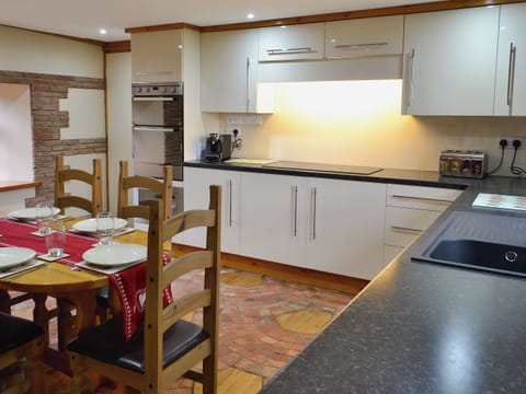Kitchen and dining area | Bridge House - Lower North Radworthy Cottages, Heasley Mill, near South Molton