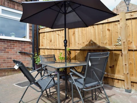Enclosed courtyard with garden furniture | Cottage on the Green, Acomb, near York