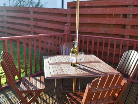 Sitting-out-area. There is also a Weber portable BBQ for outside dining. A selection of outdoor garden games provided for sunny days | Riverside Cottage, Drumnadrochit, near Loch Ness