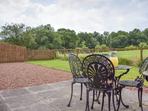 Lovely countryside views from the patio | The Stables - Loch Lomond Farm Cottages, Balfron Station, near Stirling