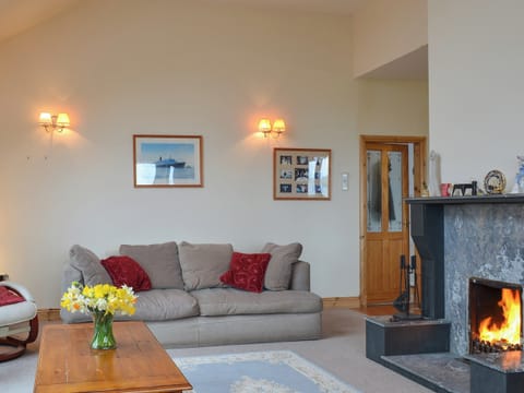 Welcoming living/dining room with open fireplace | Sealladh Lingeigh, East Kilbride, near Lochboisdale, South Uist
