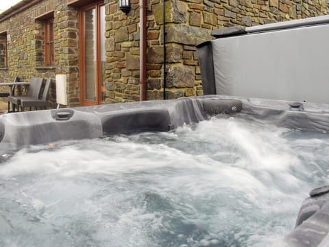 Luxurious hot tub on the patio | Tan Y Dderwen - Ffynnonmeredydd Cottages, Mydroilyn, near Aberaeron