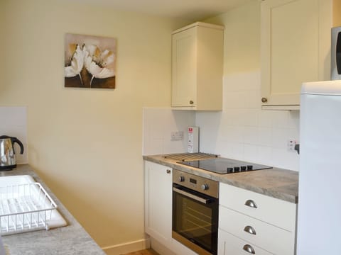 Well-equipped fitted kitchen | Foulden Hill Farm Cottage, Foulden
