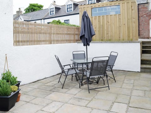 Large patio area | Rosslyn Cottage, Portmahomack, near Tain