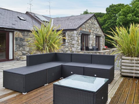 Spacious patio with furniture | Glanrafon Isaf, Llanfaglan, Caernarfon