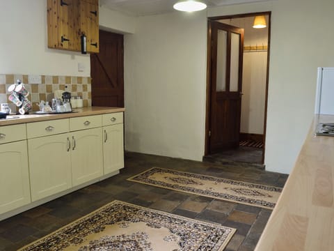 Farmhouse style kitchen with breakfast area | Bettws y Gwynt, Llanbedrgoch, near Benllech