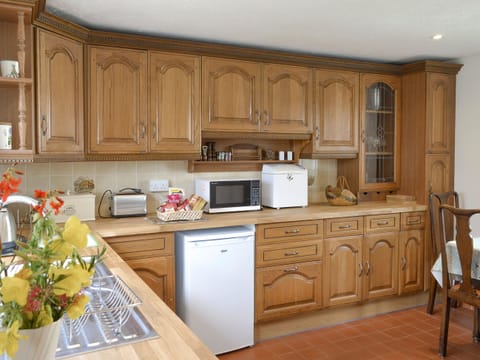 Light and airy kitchen with convenient dining area | Preswylfa, Llanddona, near Bangor