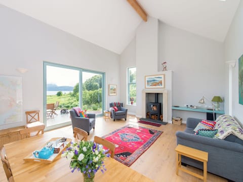 View of open plan living room from kitchen. Light, space and warmth radiates throughout the house | Tigh An Iasgair, Fearnbeg, near Applecross