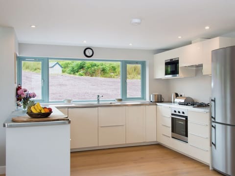 Large, well equipped (oven, microwave, fridge freezer, dishwasher) and modern kitchen with oak wooden floors. | Tigh An Iasgair, Fearnbeg, near Applecross