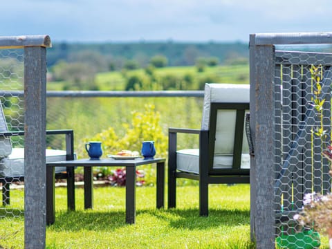 Beautiful new back garden, with spectacular views over the Peak District and comfortable lounge furniture | Bailey&rsquo;s Barn, Bonsall, near Matlock