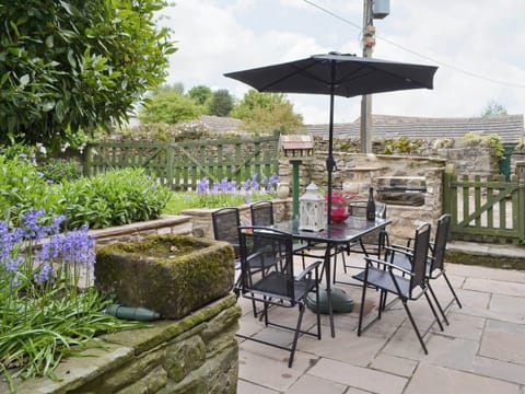 Outdoor eating area with built-in BBQ | Cherry Tree Cottage, Bellerby, Wensleydale