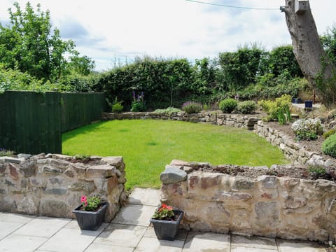  Enclosed lawned garden with patio and garden furniture | Dolfran Bach, Dolwen, near Betws-yn-Rhos, Abergele