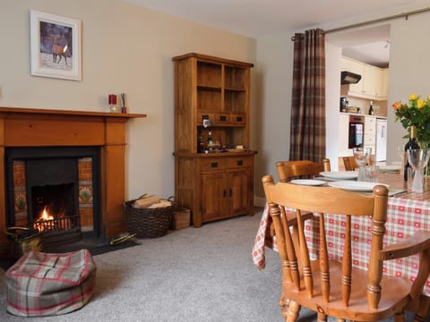 Attractive and warm dining room with open fire | Toad Hall, Aberfeldy