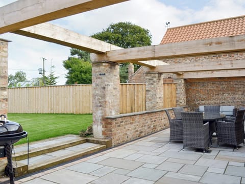 Spacious patio area | Bluebell Barn, Dunnington, near York