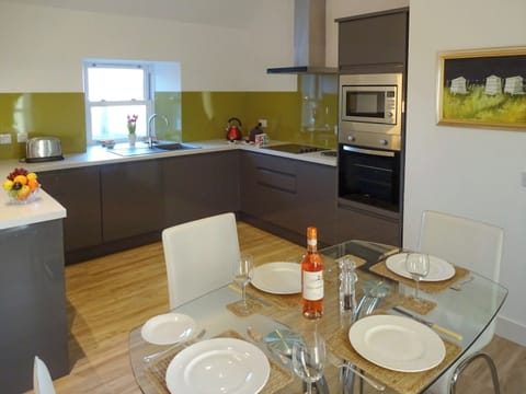 Well-equipped fitted kitchen with dining area | Charlie&rsquo;s Cottage, Muasdale, near Campbeltown