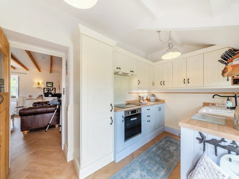 Farmhouse style kitchen with tiled floor | Lake View Cottage, Yarrow Moor, near Bellingham