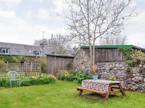 Enclosed lawned garden with sitting out area | Larch Cottage, Kirkmichael, near Pitlochry