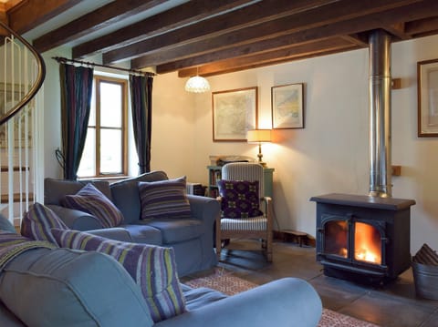 Comfortable and warm living area with wood burner | Y Bwthyn - Fachongle Ganol Cottages, Fachongle Ganol, near Newport