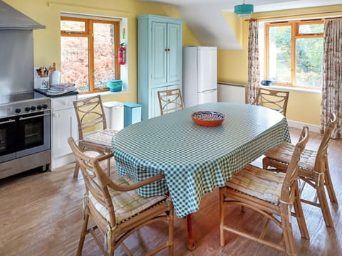 Kitchen dinner | Erw Goed Old Barn, Arthog, near Dolgellau