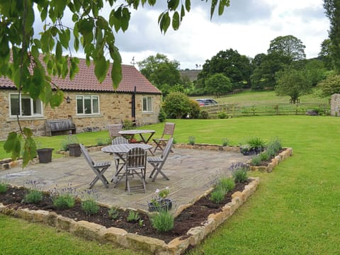 Garden with paved seating area | Knayton Moor Cottages, Knayton, nr. Thirsk