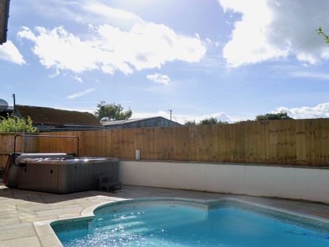 Luxurious hot tub on patio at poolside | Celyn, Montgomery