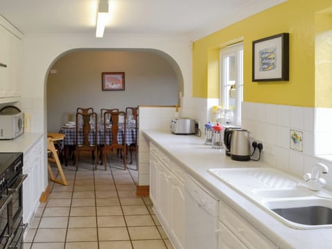 Spacious kitchen leading into dining area | Pembroke House, Happisburgh