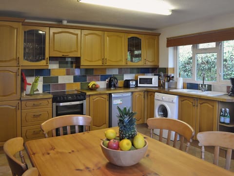 Farmhouse style kitchen/diner with lasrge pine dining table | Ponsgwedhen, Coverack, near Helston