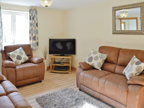 Cosy lounge | Hen Ysgubor - Bwlchgwyn Equestrian Holidays, Arthog, near Fairbourne