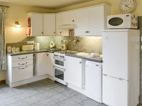 Well-equipped fitted kitchen | Riverside Cottage, Old Costessey