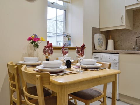 Convenient dining area within kitchen | Mill Shore Cottage - Nethermill Cottages, Pennan, near New Aberdour