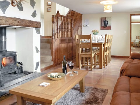 Spacious lounge with wood burning fire and dining area | Ty Hir - Bwlchgwyn Equestrian Holidays, Arthog, near Fairbourne