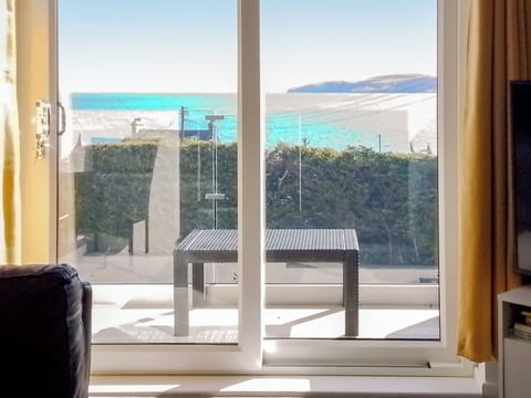 Lounge/ balcony | Beach Cottage, Benllech