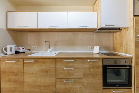 Comfort Apartment, 1 Bedroom, Sea View | Private kitchen | Coffee/tea maker, electric kettle, highchair