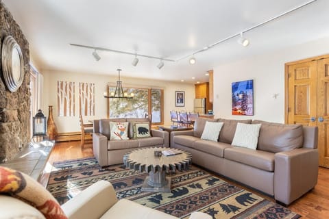 Spacious living room with cozy fireplace and rustic charm
