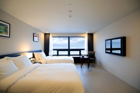 Deluxe Room, Multiple Beds, Non Smoking | Down comforters, in-room safe, desk, soundproofing