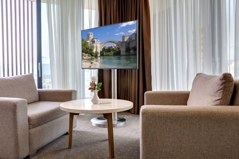 Suite, Balcony, City View | Minibar, in-room safe, desk, blackout drapes