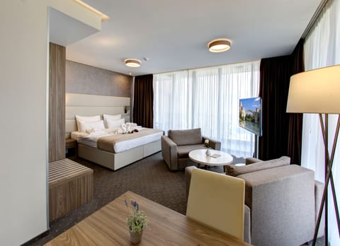 Suite, Balcony, City View | Minibar, in-room safe, desk, blackout drapes