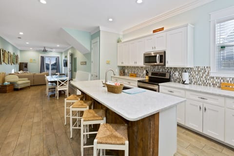 Fully stocked kitchen, one of two in the home, makes inside or outdoor cooking easy with everything at your fingertips! Refrigerators on both floors offer dual ice-makers to keep up with the demand for cold drinks on a hot summer day!