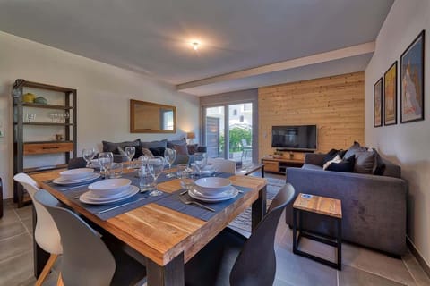 Open plan living space with kitchen, dining and lounge with comfortable double sofa bed