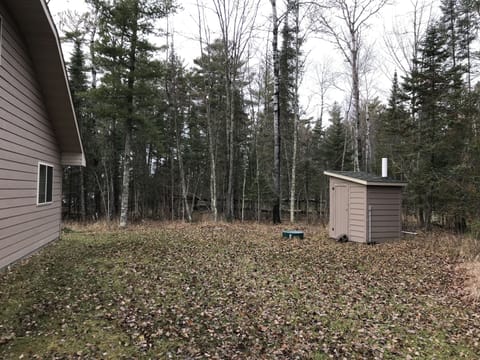 Outdoor bathroom with a light