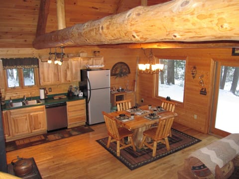 Kitchen with stainless steel appliances and sliding doors to deck