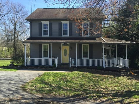 peaceful country style home. Nestled in the country alongside a trout stream