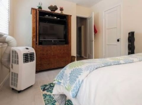 Bedroom with portable A/C.