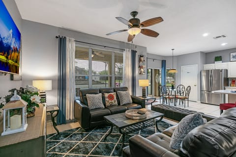 Stunning family room plus 62" smart TV. with pool view.