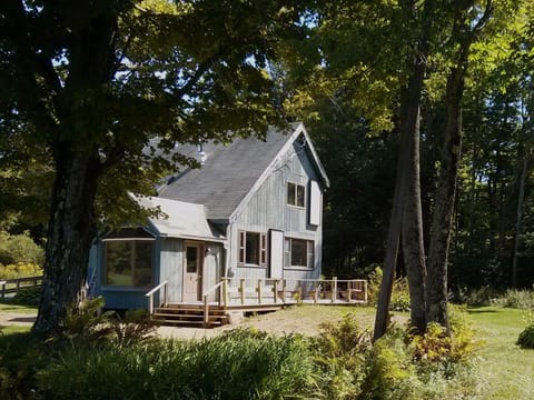 View of house as seen from road near the brook