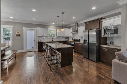 Open Kitchen Design with Bar Seating for 4