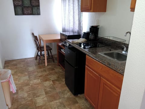 Fridge, microwave, stovetop, coffee/tea maker