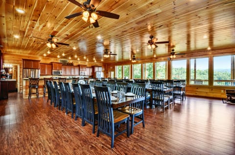 Angled photo of the dining area and its many tables and chairs.