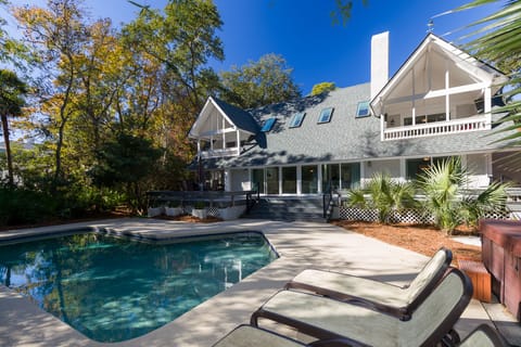 Exterior of House, fully surrounded landscaping, private pool. 